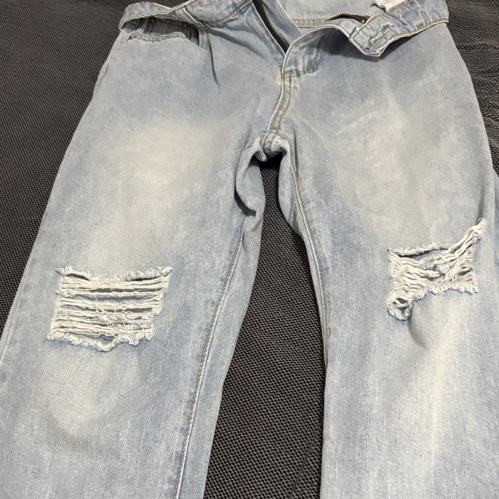 Stylish Light Blue Distressed women’s jeans. Size 26.